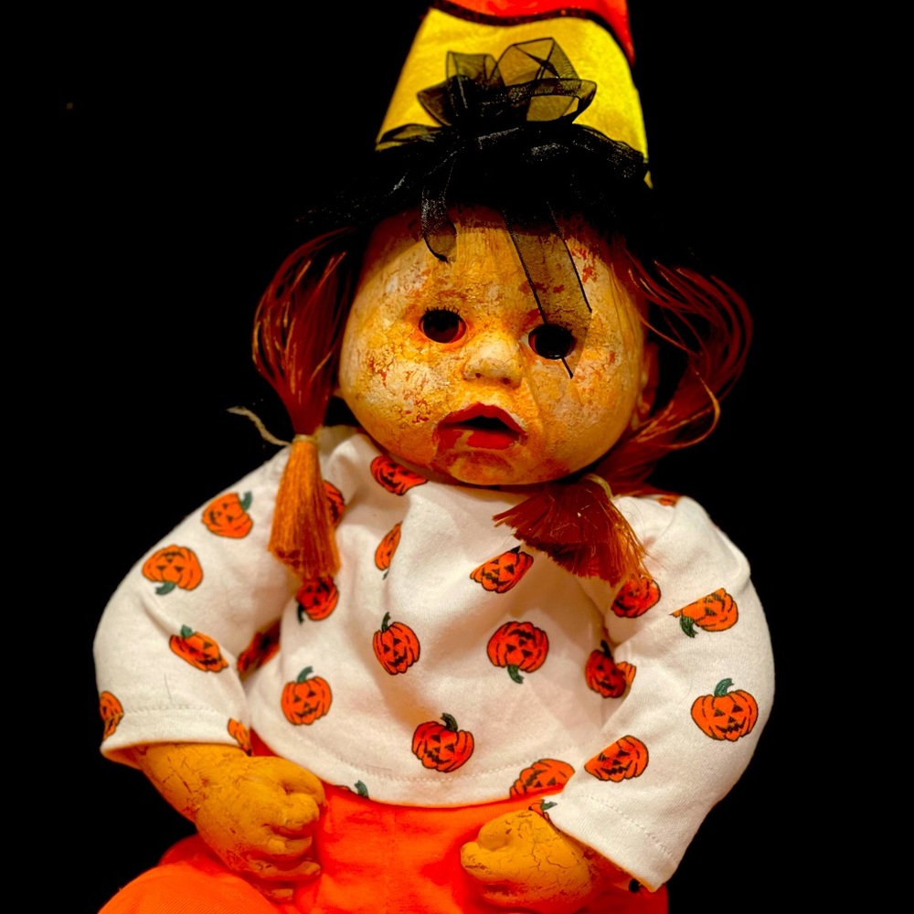 Creepy Doll Mrs. Pumpkin & Mr. Spice had a baby Latte.